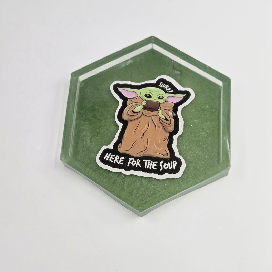 Green character coaster