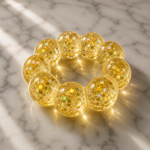 Load image into Gallery viewer, orange Feelzies™ Original Squishy Bracelet: Sunburst Orange fidget
