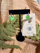 Load image into Gallery viewer, Shimmery green monstera leaf silver huggie hoops
