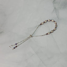 Load image into Gallery viewer, Sheet Music Slider Knot Paper Bead Bracelet w/ purple glass spacer beads &amp; silver music note charm
