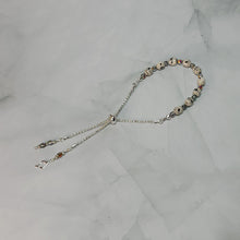 Load image into Gallery viewer, Sheet Music Slider Knot Paper Bead Bracelet w/ silver glass spacer beads &amp; silver music note charm
