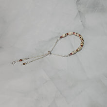 Load image into Gallery viewer, Sheet Music Slider Knot Paper Bead Bracelet w/ pink/green glass spacer beads &amp; silver music note charm

